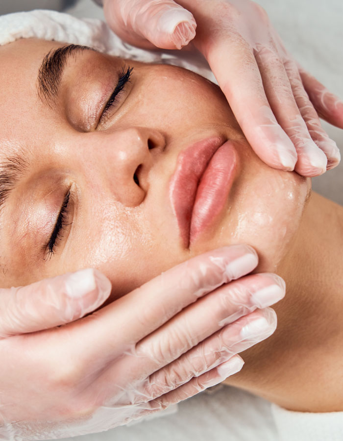 Woman getting face treatment
