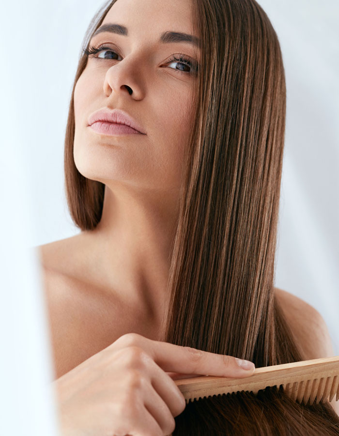 Woman combing her hair
